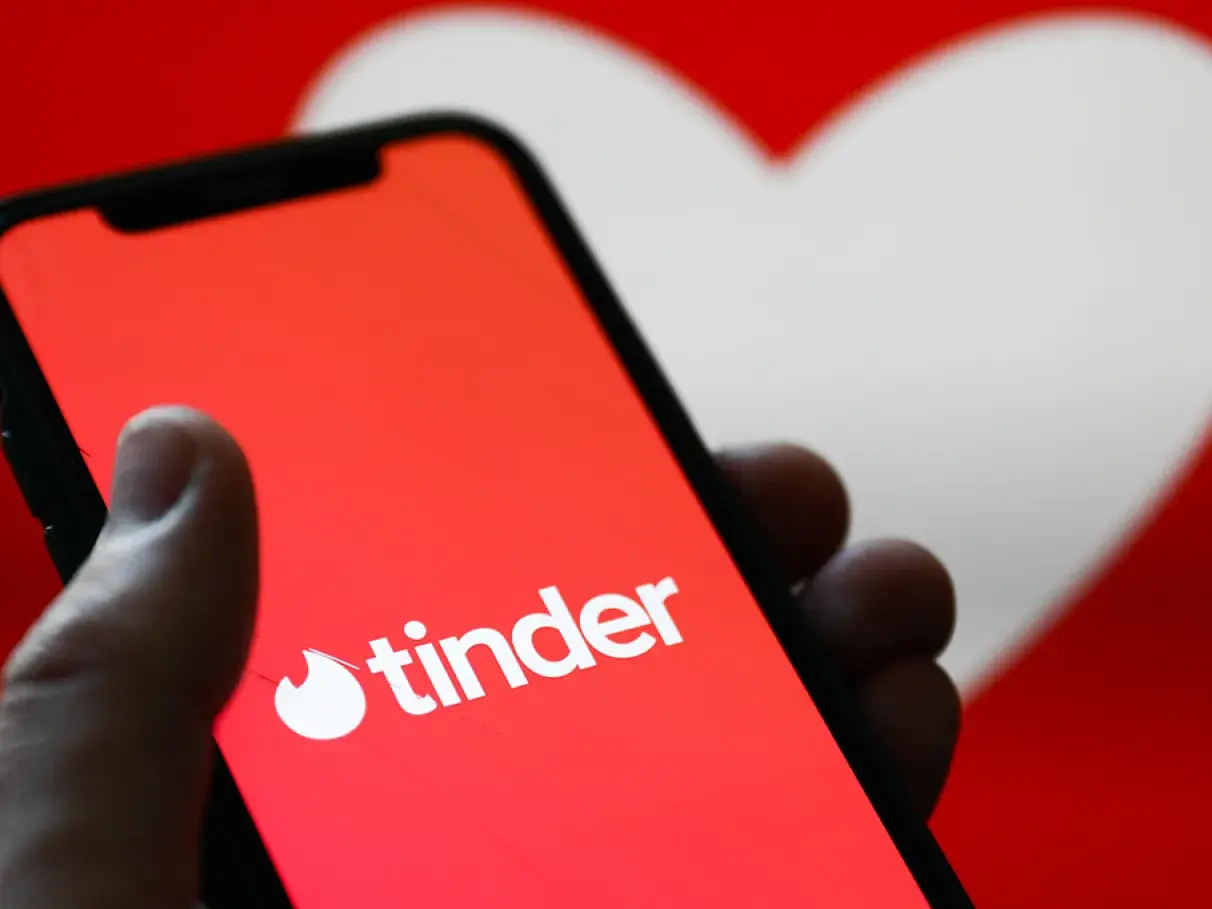 photo of a cell phone with tinder written on it